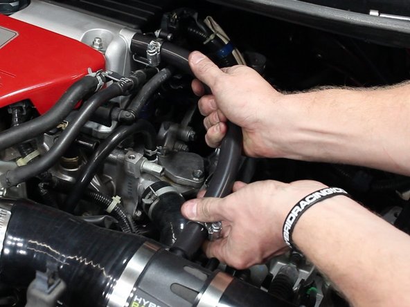 Install and tighten the valve cover breather tube.