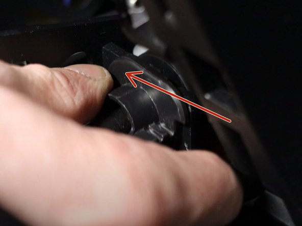 Rotate the left side shifter cable counter-clockwise and slide it upwards, removing it from the shifter base.