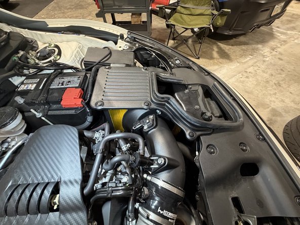 If you did the lower inlet: reinstall the engine undercover and front inner fender with their factory fasteners, then mount the front wheel, lower the car, and torque the lug nuts.