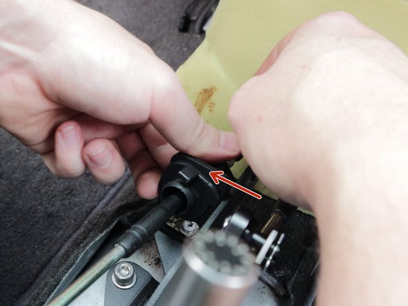 Tap the retaining clip down into place, make sure the clip touches the top of the cable. It isn't necessary for the clip to rest on the top of shifter.