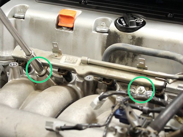 Remove the 12mm nuts that mount the fuel rail to the intake manifold.