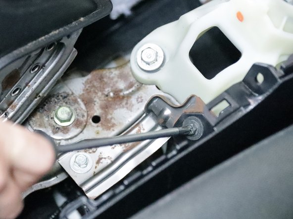 Remove the screws holding the upper console in place.