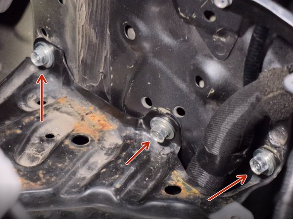 Remove the three larger bolts holding the battery tray to the shock tower.