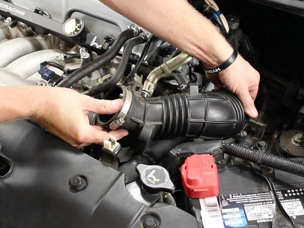 Remove the intake tube from the throttle body.