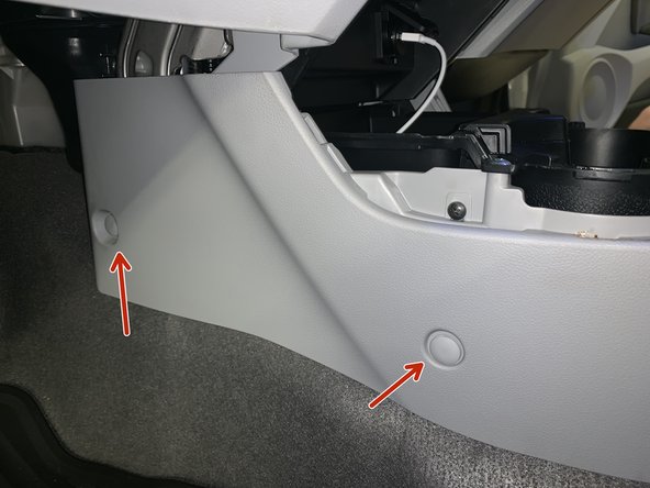 Remove the console clips. There are two on each of the front sides.