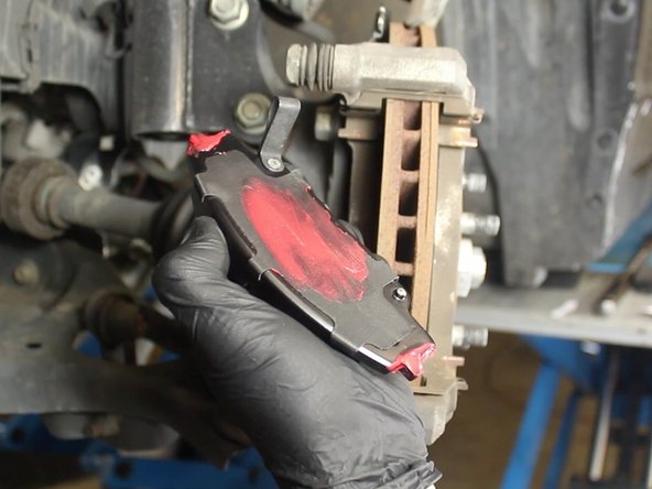 Apply a small amount brake pad lubricant to the back of each brake pad and to each end where the pad makes contact to the caliper.