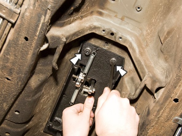 Get underneath the vehicle.