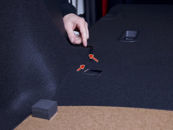 Route the power harness around the corner of the rear seat and down through the rear panel. Conceal the wire as best as you can.