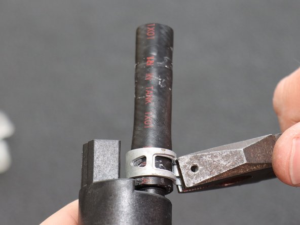 Install the rubber hose on the new Hybrid Racing fuel pump. Be sure to use the included line and clamps if your hose is not in good shape.