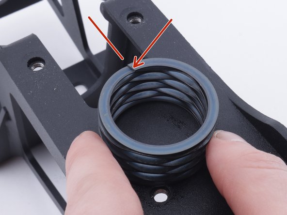 Install the new spring on the shifter base.