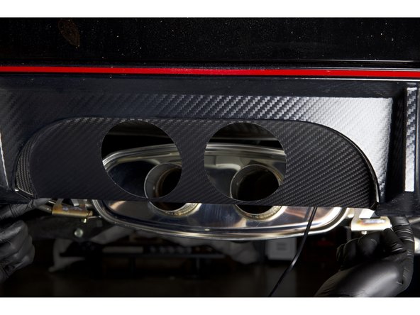 Install the HR carbon rear panel into the bumper using the factory clips. This panel should sit flush at the top and around the bumper seam.