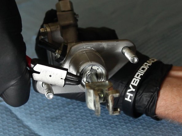 Using a pair of C-Clip pliers, squeeze the C-clip and remove the OEM CMC rod &amp; fork.