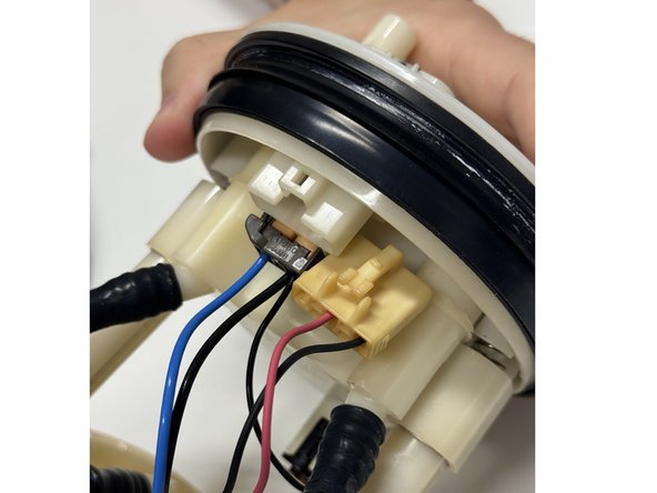 A flat-tipped screwdriver can help separate them. Be sure not to crack the plastic.