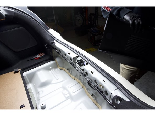 Pull upward on the rear plastic panel to remove it. Once removed, set aside.