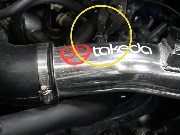 With a pair of pliers, remove the air intake accessory tubes.