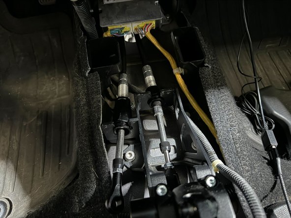 Put cables into there position on shifter (See 2nd image).
