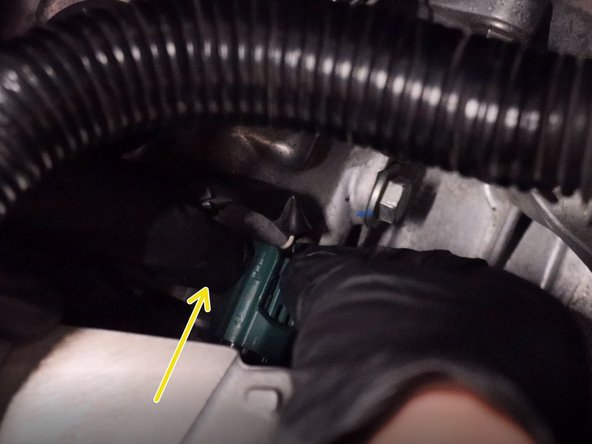 Unplug the reverse sensor on the top of the transmission.