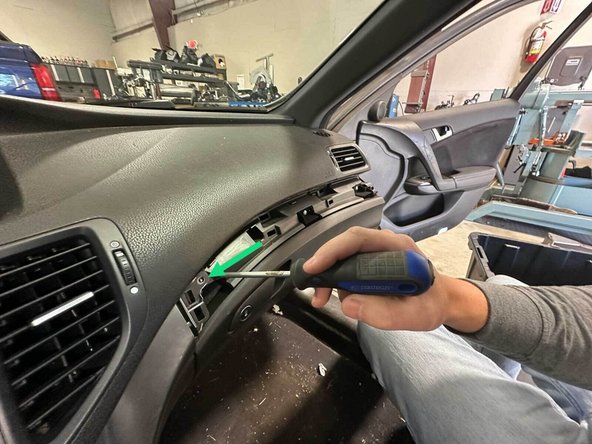 Once the panel is removed remove this screw to free up the side panel.