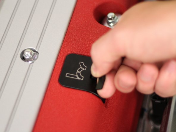 Grab the latch and pull upwards to remove the dipstick from the engine.