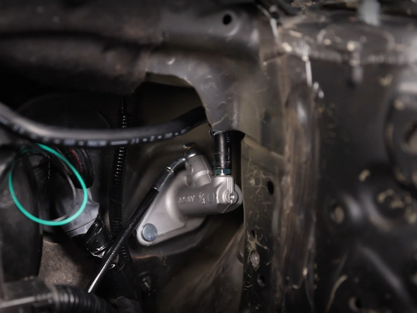 Install the reservoir hose to the new CMC and reinstall the clamp.