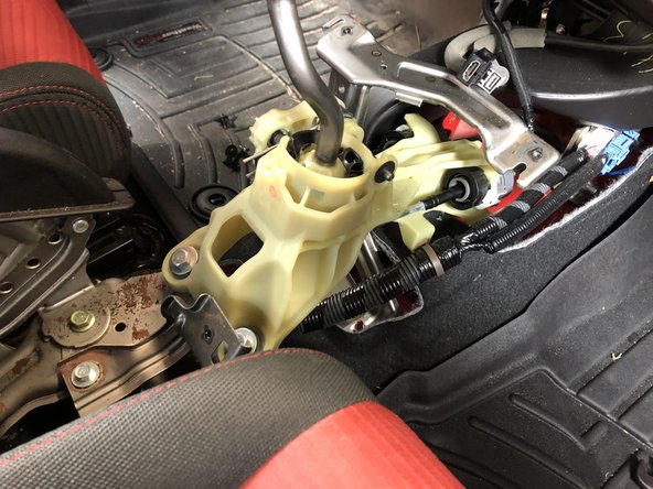 Once everything is disconnected, slide the center console to the rear seats. Lift up he back and remove the console completely.