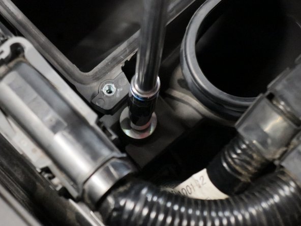 Pull the airbox up and remove it from the engine bay.