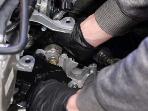 Once they are removed, slide the cables out of the bracket.