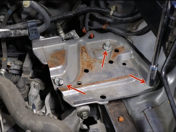 Remove the three bolts holding the battery tray in place