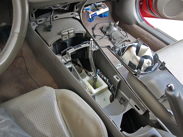 Once unclipped, remove the center console cover and place it off to the side.