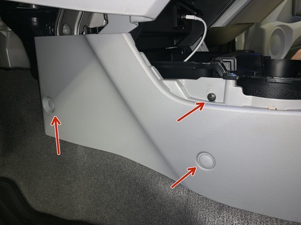 Remove the console clips and screws. There are two clips and one screw on each side.