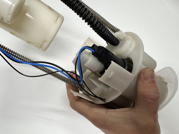 You can now plug the new pump in using the factory connector.