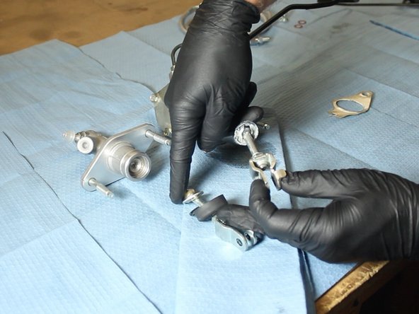 Be sure to grease the rod before inserting it into the EM1 CMC. You can use some of the grease that is on the CMC, or supply your own.