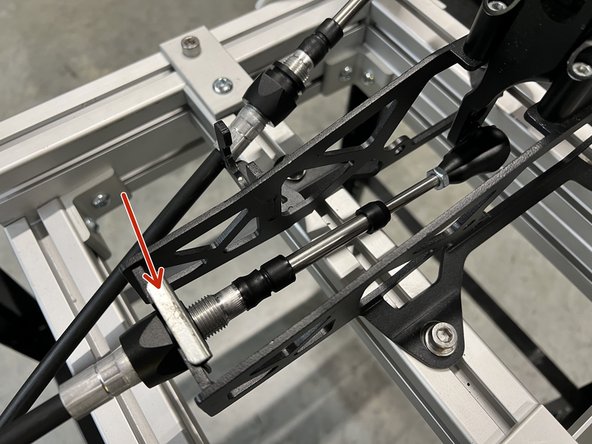 Insert the shifter cables through the shifter base and secure them to the shifter with cotter pins. We do not supply the shifter side hardware.