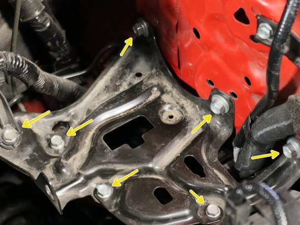 Remove the battery, heat shield and unbolt the lower battery tray.