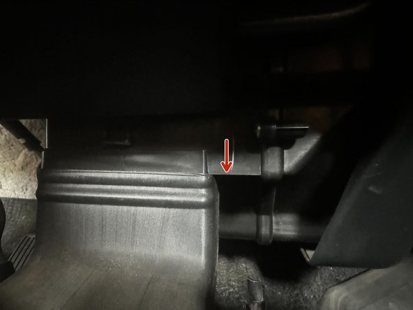 Reinstall the HVAC duct. Push up until the top of duct is level highlighted part of dashboard (Red Arrow)