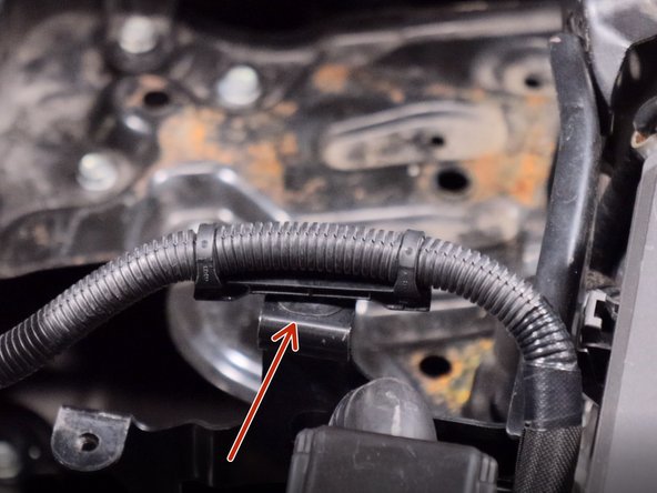 Unclip the wire harness from the ECU bracket.