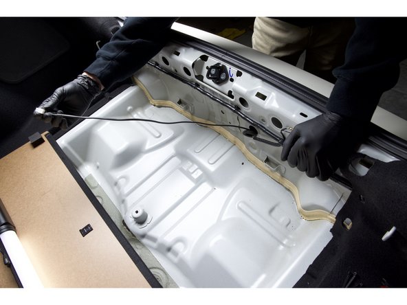 Pull all but a little slack through the floor and prepare to mount the controller box.