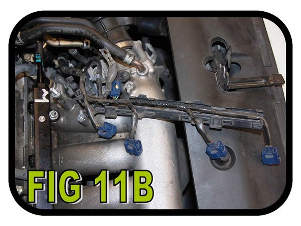 Next we need to remove the plastic cover on the injector wiring harness so we can relocate it. Using a flat head, pry each clip apart and remove the cover as shown in FIG 11A and FIG 11B.