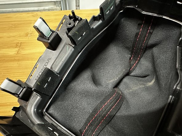 You must remove all of the staples before you are able to remove the shift boot.