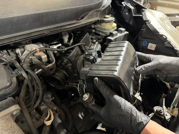 Route intake into place by pushing air-duct behind ECU.