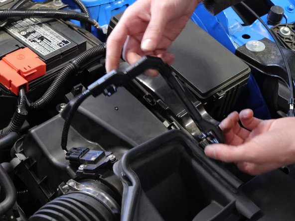 Unclip the MAF wiring harness from the airbox lid and then unplug the MAF and set it aside.