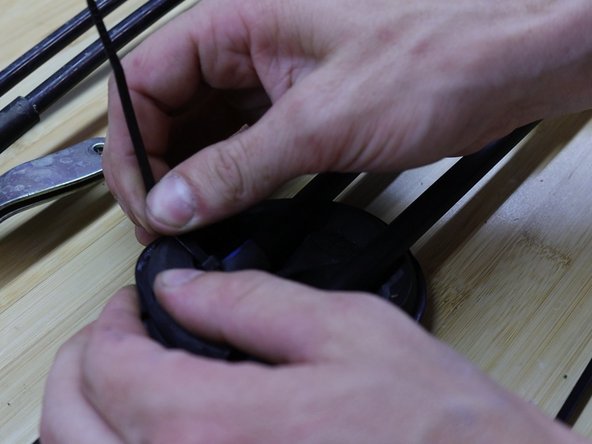 Secure the floor seal with both supplied zip ties. These ties help the cable stay in place.