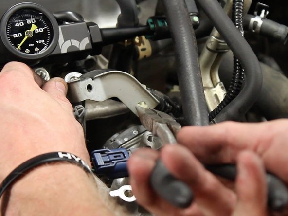 Unclamp the MAP sensor wire harness from the bracket and discard the bracket.