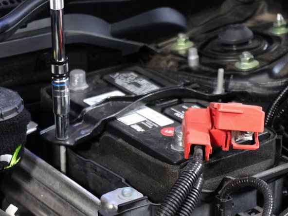 Unbolt and remove the battery tie-down bracket.