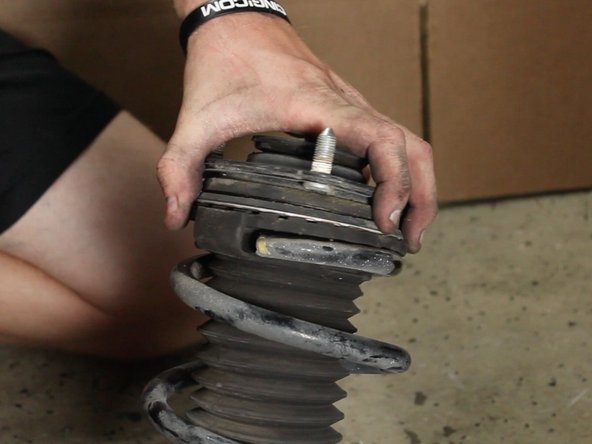 Remove the upper strut mount assembly.