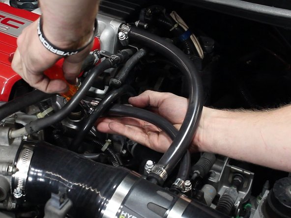 Install and tighten the second vacuum hose.