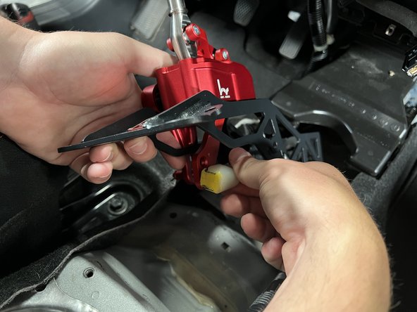 Prepare the new Hybrid Racing shifter and reinstall the RH side shifter cable clip.