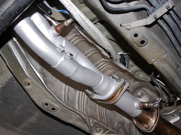 Finally, using your 10mm socket re-install the heat shield with the (4) M6 bolts and (2) nuts and your installation is complete!