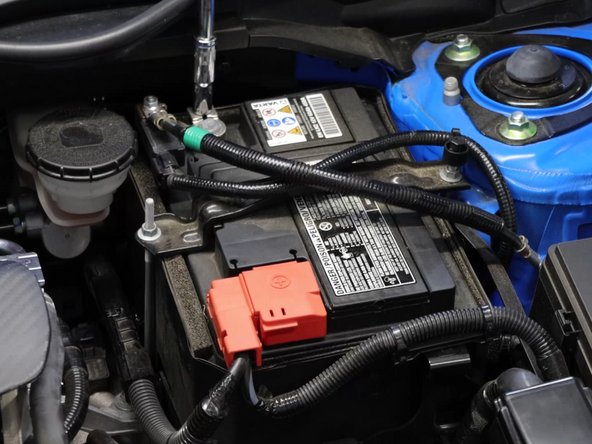 Remove the negative then positive terminal from the battery.