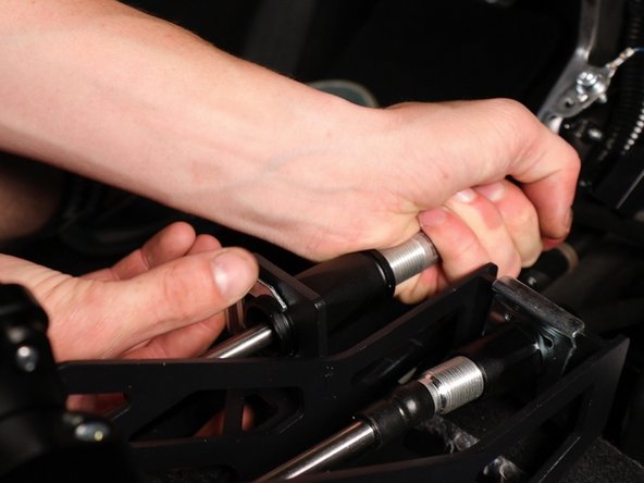 Inside the car, attach the cables to the shifter.